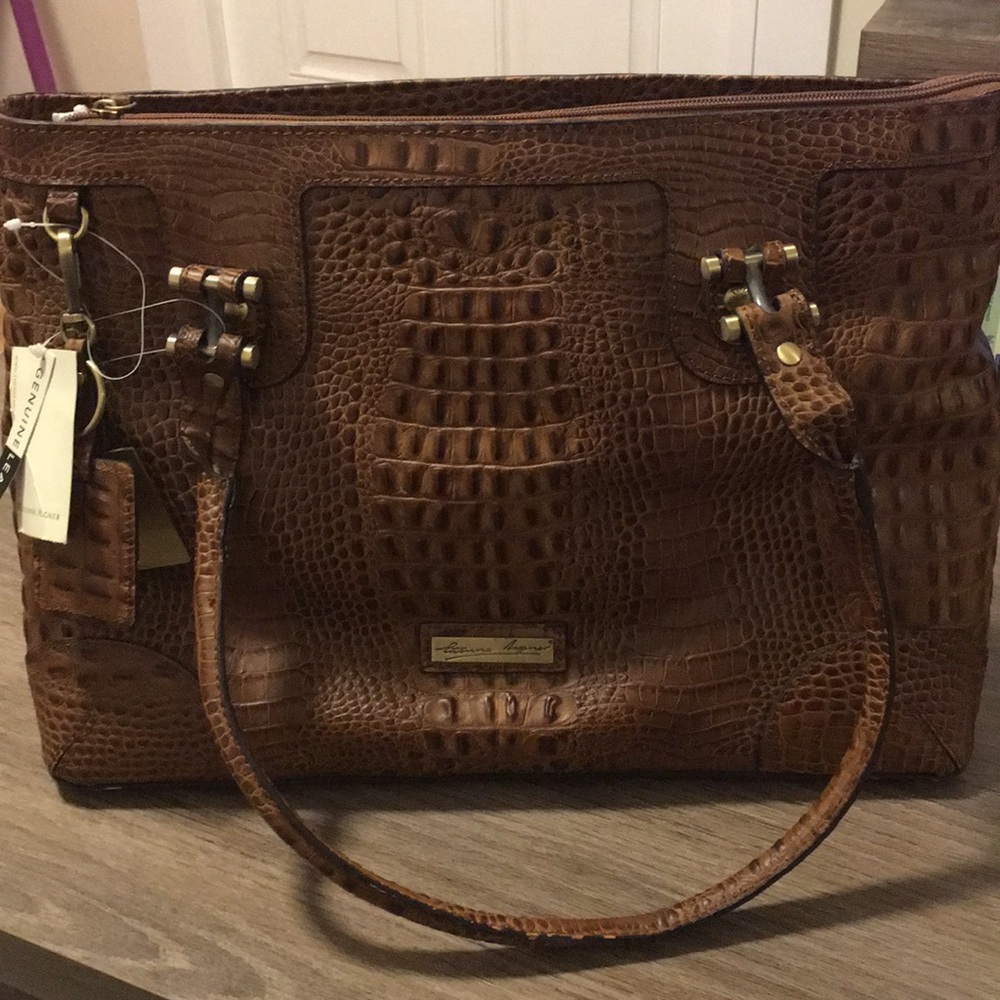 Genuine leather Etienne Aigner alligator handbag.